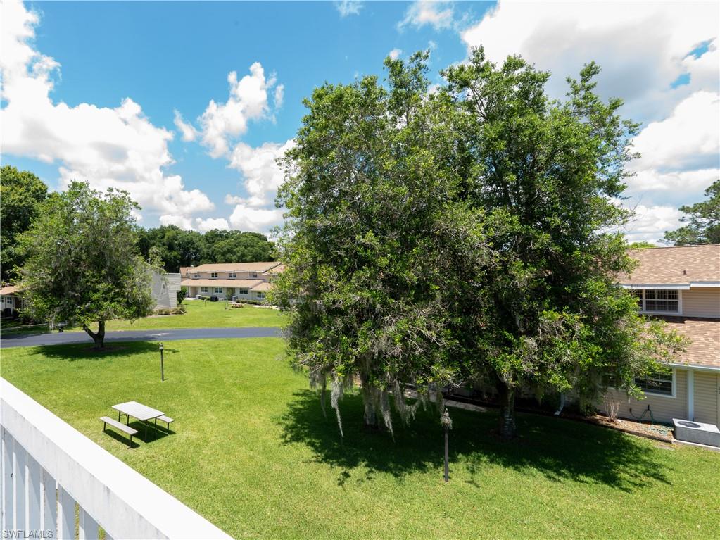11001 Southeast Sunset Harbor Road, Unit 34 Summerfield, FL 34491 - Photo 23 of 31 View of yard