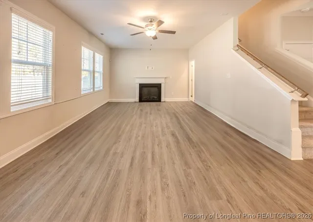 a bathroom with a granite countertop sink a toilet and a large mirror