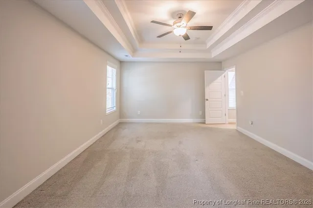 an empty room with a empty space and windows