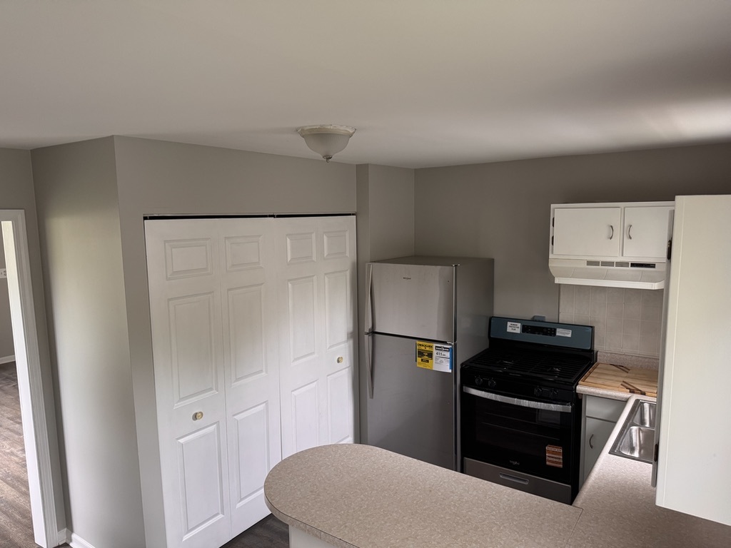 7506 Algonquin Road Wonder Lake, IL 60097 - Photo 3 of 11 a kitchen with cabinets and refrigerator