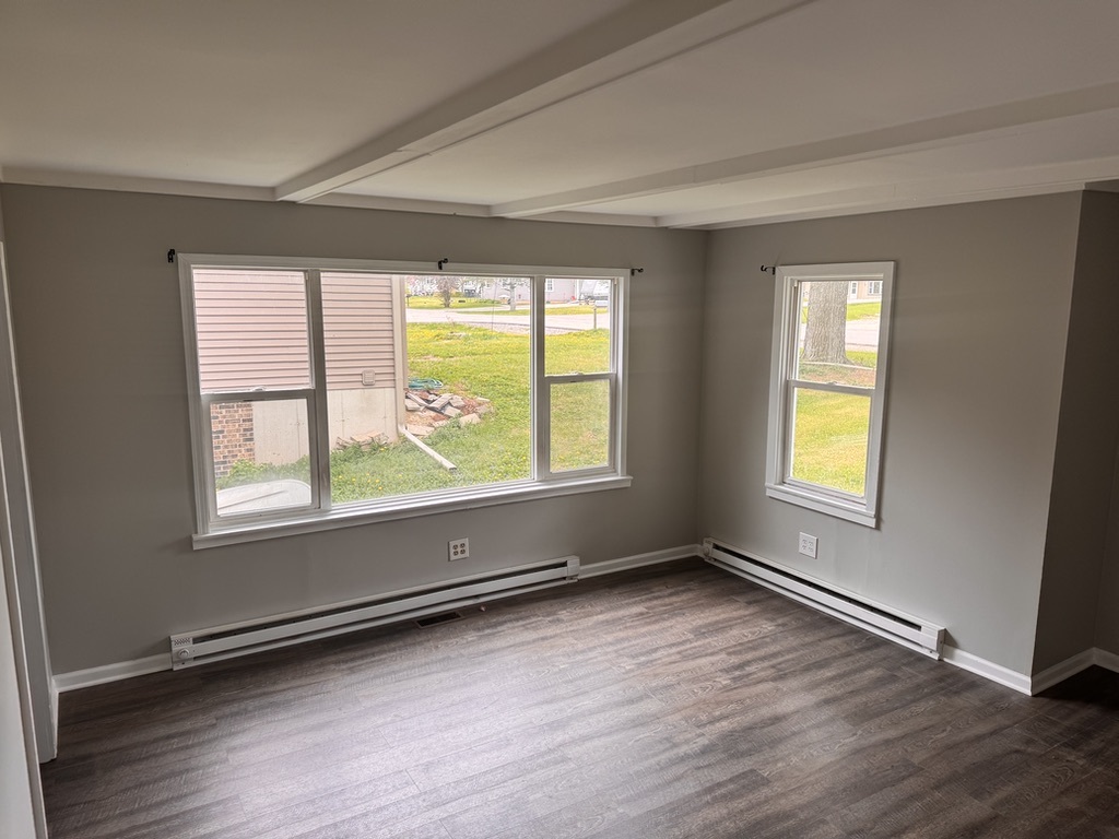 7506 Algonquin Road Wonder Lake, IL 60097 - Photo 5 of 11 a view of an empty room with wooden floor and a window