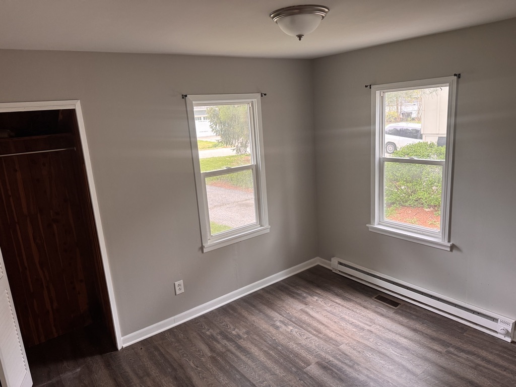 7506 Algonquin Road Wonder Lake, IL 60097 - Photo 7 of 11 a view of an empty room with wooden floor and a window