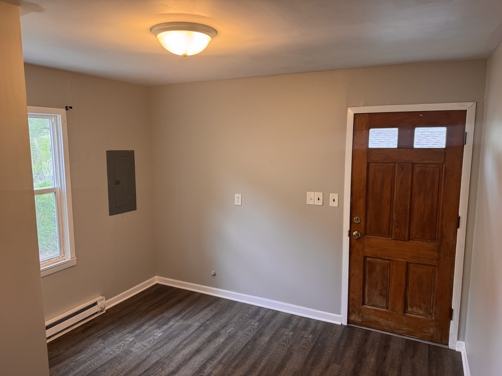 7506 Algonquin Road Wonder Lake, IL 60097 - Photo 9 of 11 an empty room with wooden floor and windows