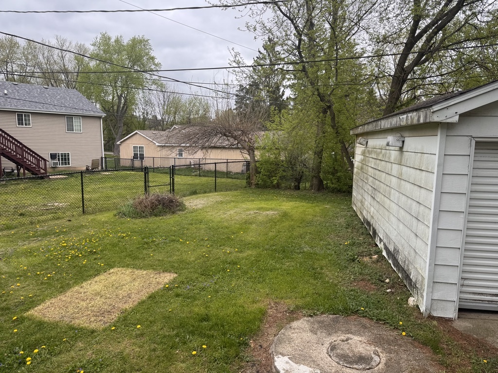 7506 Algonquin Road Wonder Lake, IL 60097 - Photo 10 of 11 a view of backyard of house and trees
