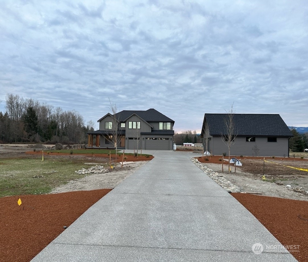 a view of swimming pool with outdoor seating and covered with trees