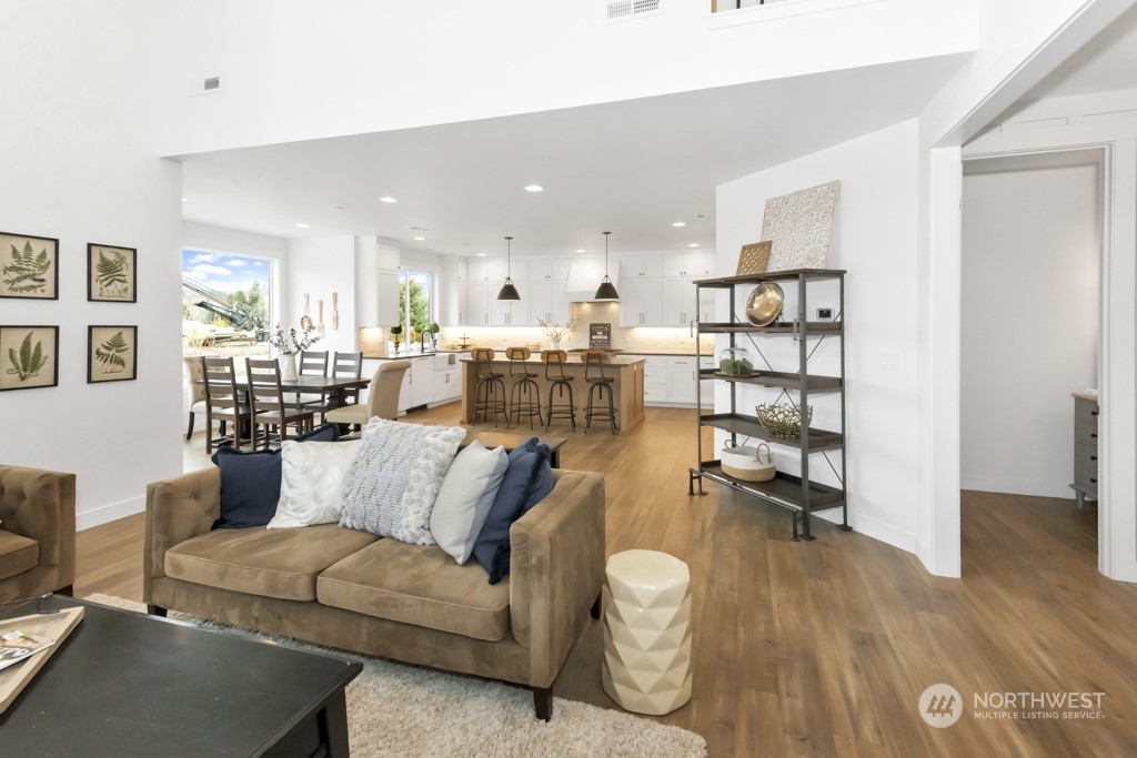 12243 Mundy Loss Road Buckley, WA 98321 - Photo 14 of 40 a living room with furniture and a wooden floor