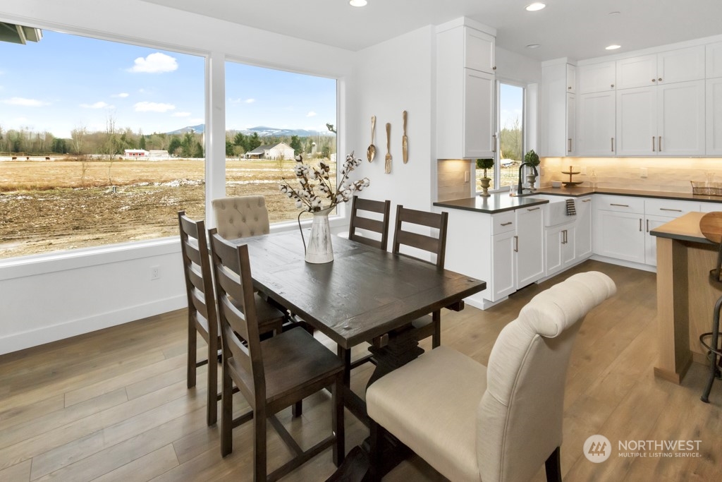 12243 Mundy Loss Road Buckley, WA 98321 - Photo 17 of 40 a dining room with furniture and a large window