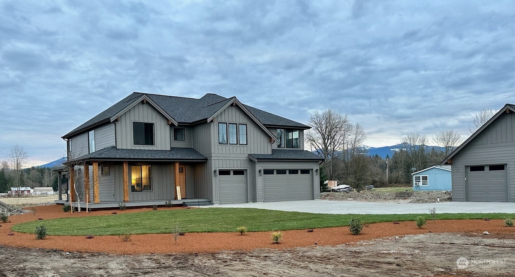 12243 Mundy Loss Road Buckley, WA 98321 - Photo 2 of 40 a front view of a house with garden