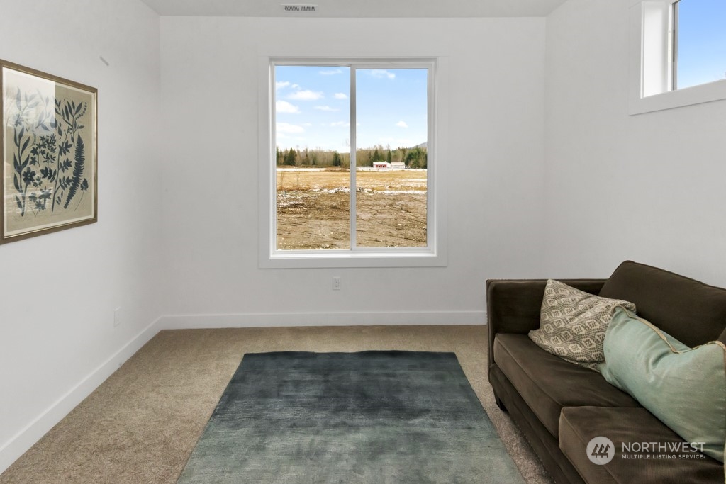 12243 Mundy Loss Road Buckley, WA 98321 - Photo 28 of 40 a living room with furniture and a window