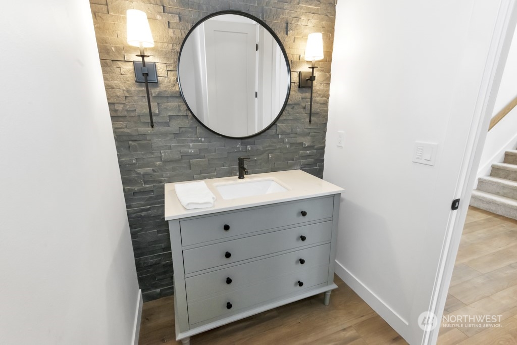 12243 Mundy Loss Road Buckley, WA 98321 - Photo 29 of 40 a bathroom with a sink mirror and vanity