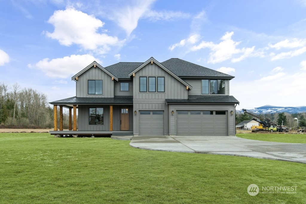 12243 Mundy Loss Road Buckley, WA 98321 - Photo 3 of 40 a front view of a house with a garden