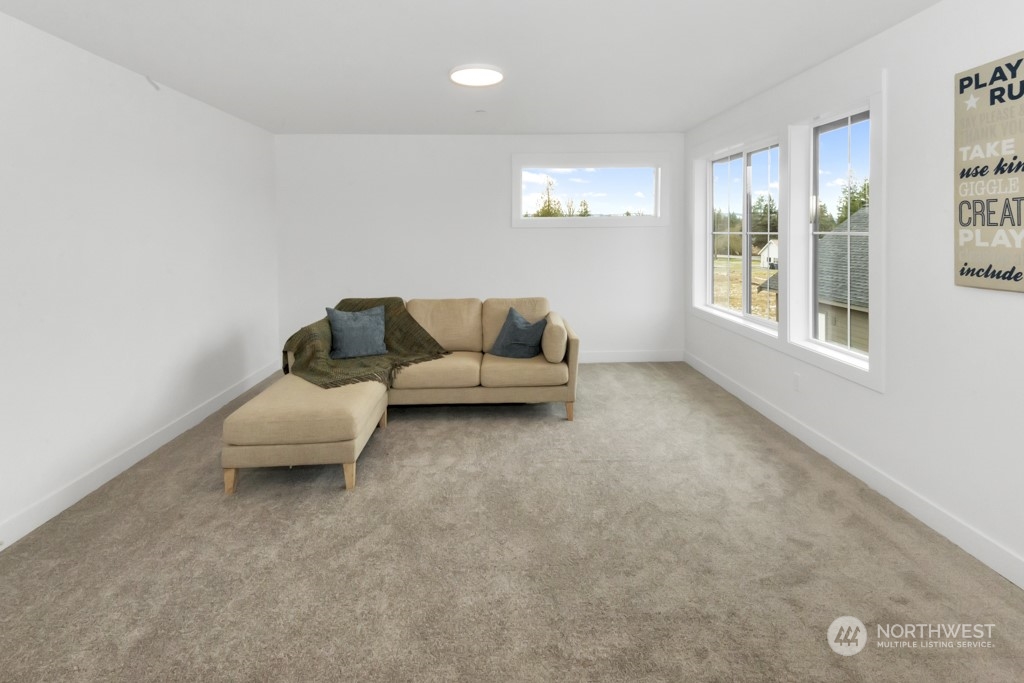 12243 Mundy Loss Road Buckley, WA 98321 - Photo 39 of 40 a living room with furniture and windows