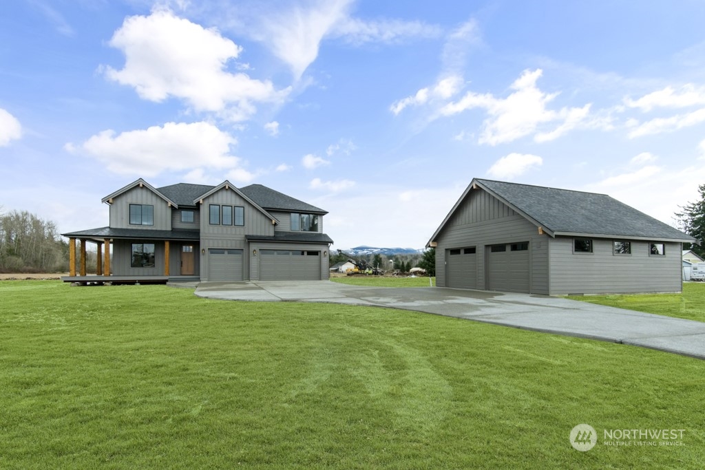 12243 Mundy Loss Road Buckley, WA 98321 - Photo 5 of 40 a front view of a house with a yard