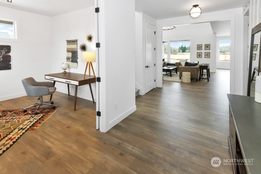 12243 Mundy Loss Road Buckley, WA 98321 - Photo 8 of 40 a view of a livingroom with furniture and hardwood floor