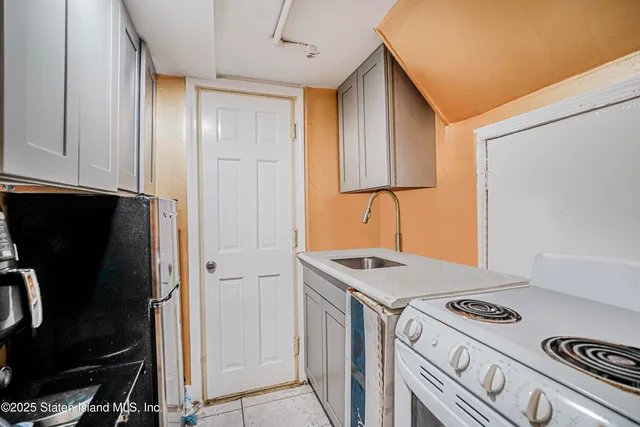 a kitchen with a stove and a refrigerator