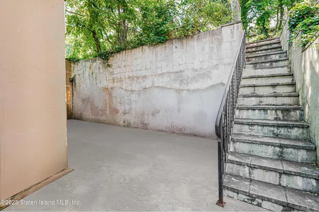 a view of wooden wall with a pot