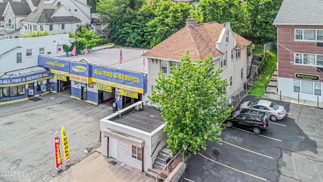 a aerial view of a house with a yard and garden