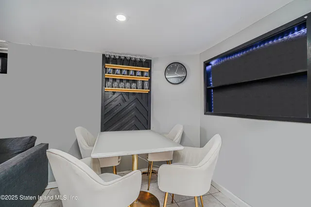 a view of a chairs and table in a room