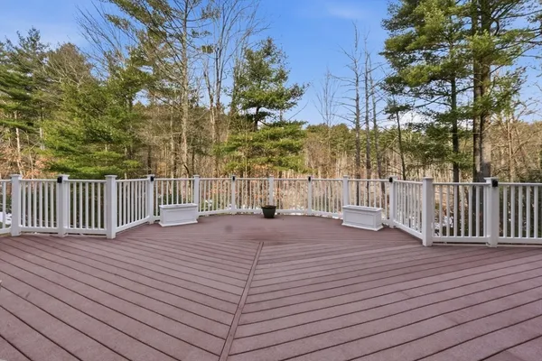a view of a house with wooden fence