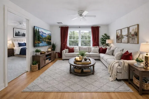 a living room with furniture and a flat screen tv