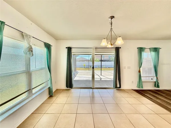 a view of an empty room with glass door