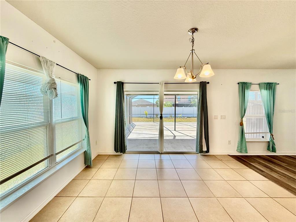 14207 Poke Ridge Drive Riverview, FL 33579 - Photo 11 of 34 a view of an empty room with glass door