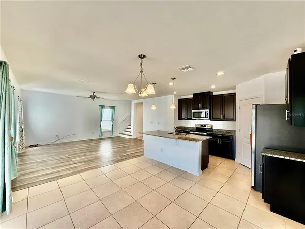 a large kitchen with cabinets