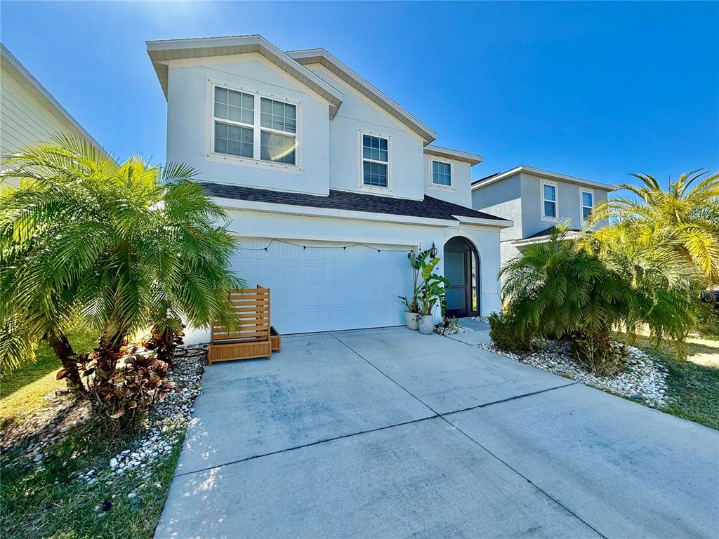 14207 Poke Ridge Drive Riverview, FL 33579 - Photo 2 of 34 a front view of a house with garden