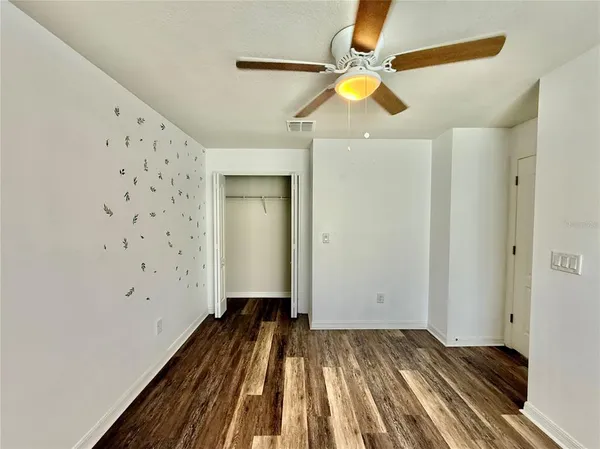 a view of a livingroom with wooden floor