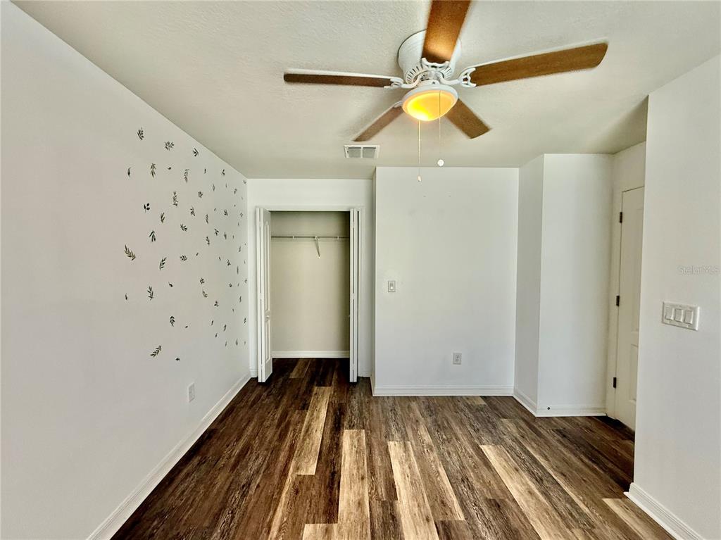 14207 Poke Ridge Drive Riverview, FL 33579 - Photo 26 of 34 a view of a livingroom with wooden floor