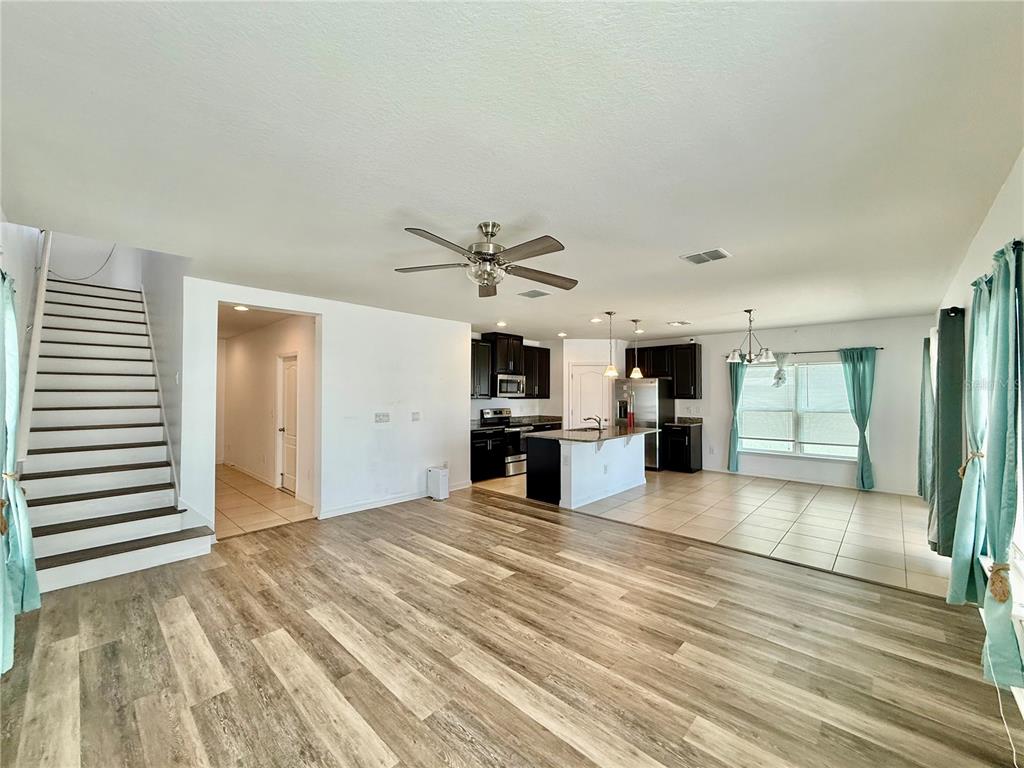 14207 Poke Ridge Drive Riverview, FL 33579 - Photo 6 of 34 a view of a kitchen with microwave and cabinets