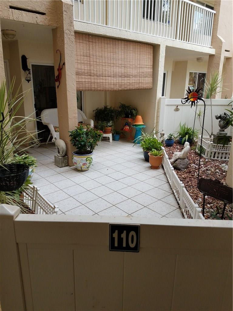 9587 Weldon Circle, Unit 110 Tamarac, FL 33321 - Photo 2 of 7 a view of outdoor space and patio