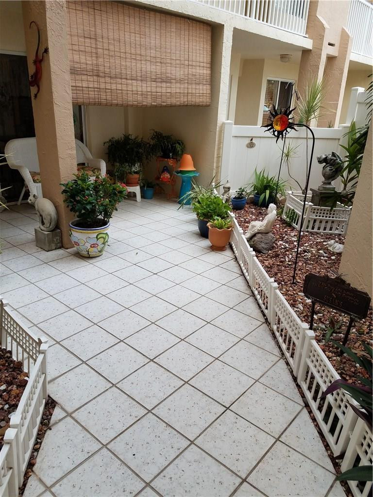 9587 Weldon Circle, Unit 110 Tamarac, FL 33321 - Photo 3 of 7 a view of lobby with chair and potted plant