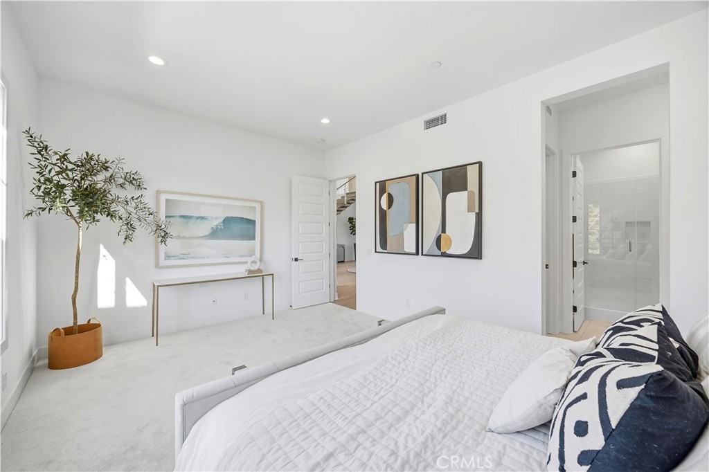20138 Marlow Lane Porter Ranch, CA 91326 - Photo 12 of 39 a bedroom with a bed and a potted plant