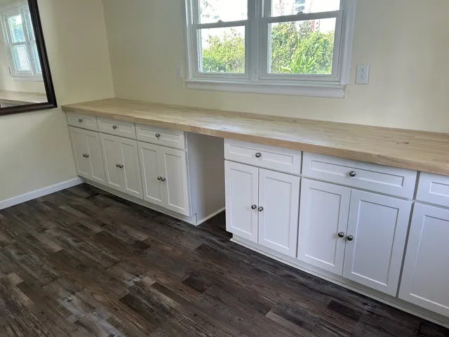 a view of a kitchen with cabinets