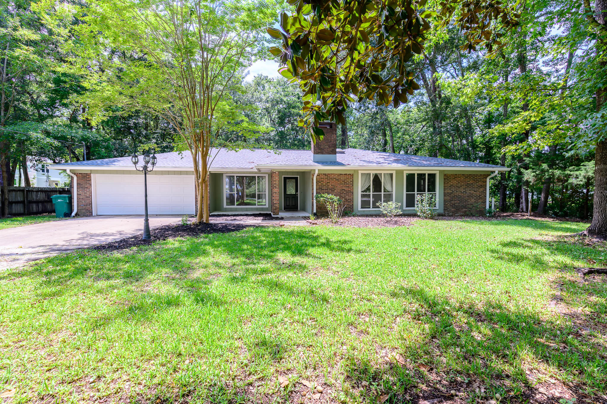 1688 Vine Avenue Niceville, FL 32578 - Photo 1 of 32 a view of a house with a backyard and a patio