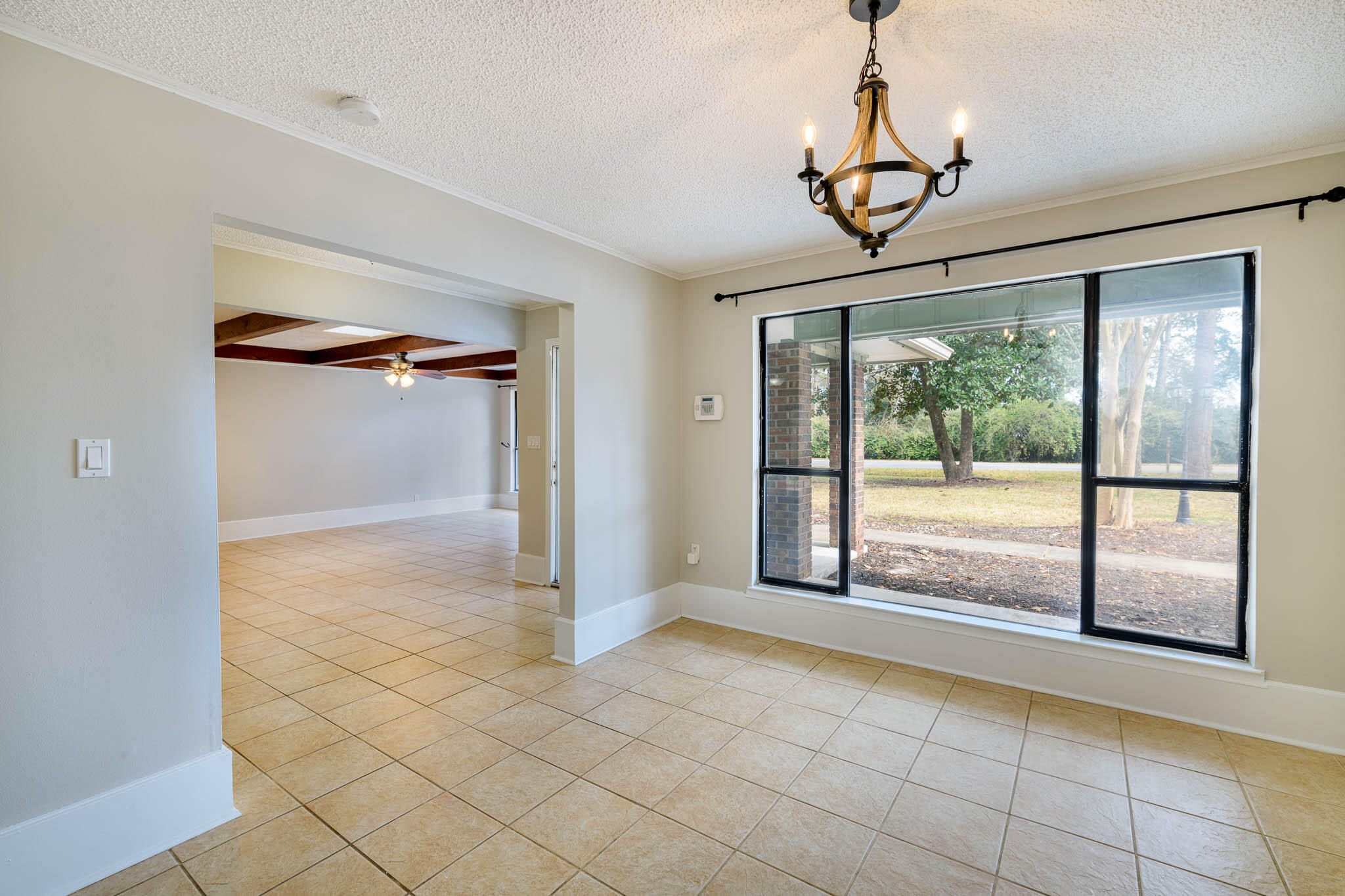 1688 Vine Avenue Niceville, FL 32578 - Photo 12 of 32 a view of empty room with wooden floor and fan
