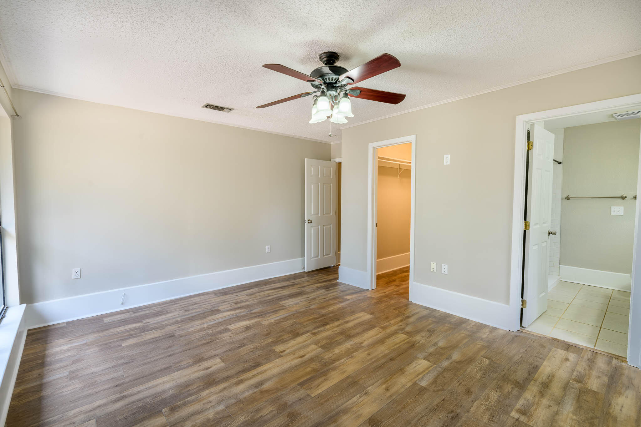 1688 Vine Avenue Niceville, FL 32578 - Photo 20 of 32 a view of an empty room with a ceiling fan