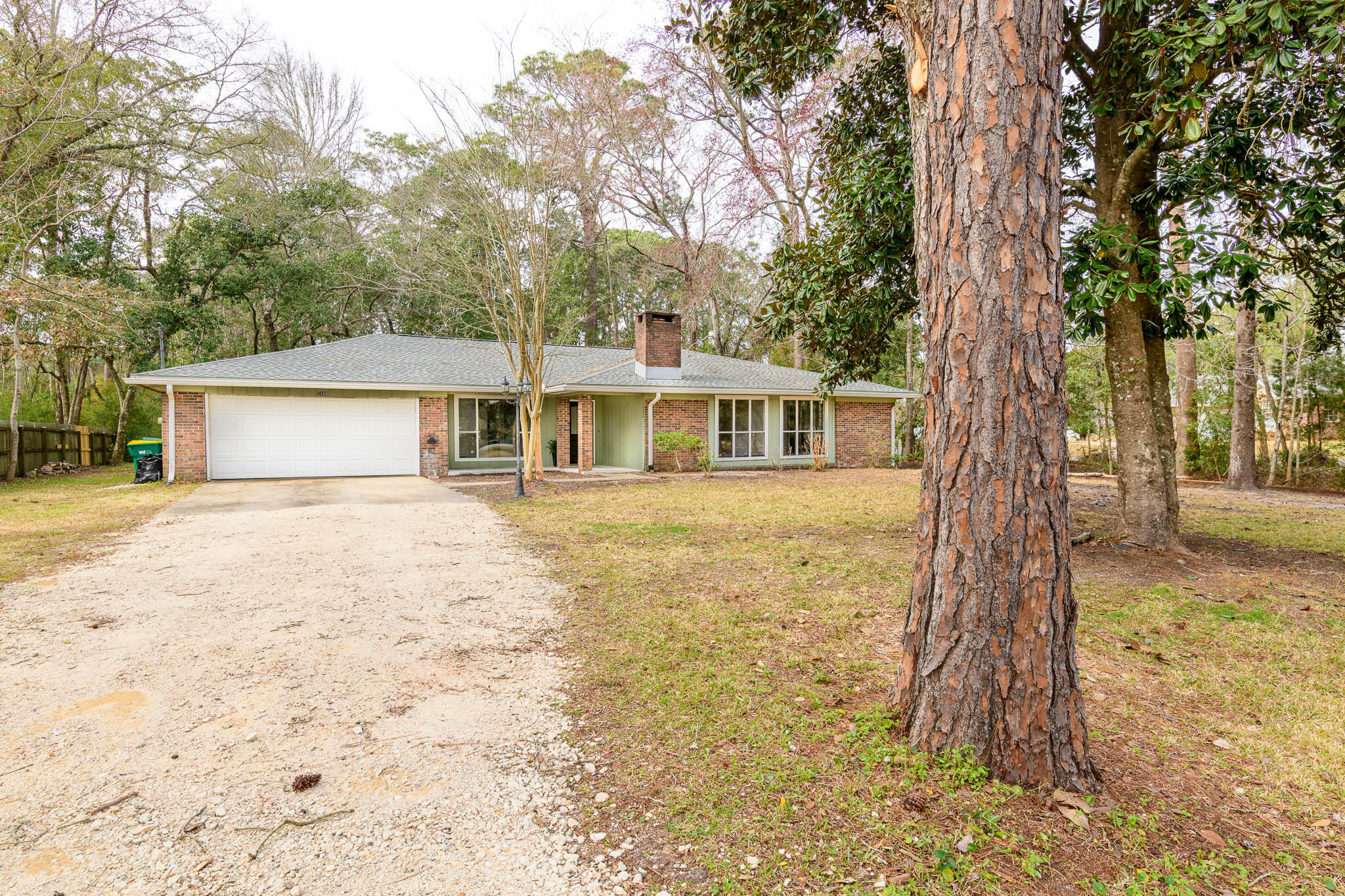 1688 Vine Avenue Niceville, FL 32578 - Photo 2 of 32 a front view of a house with a garden