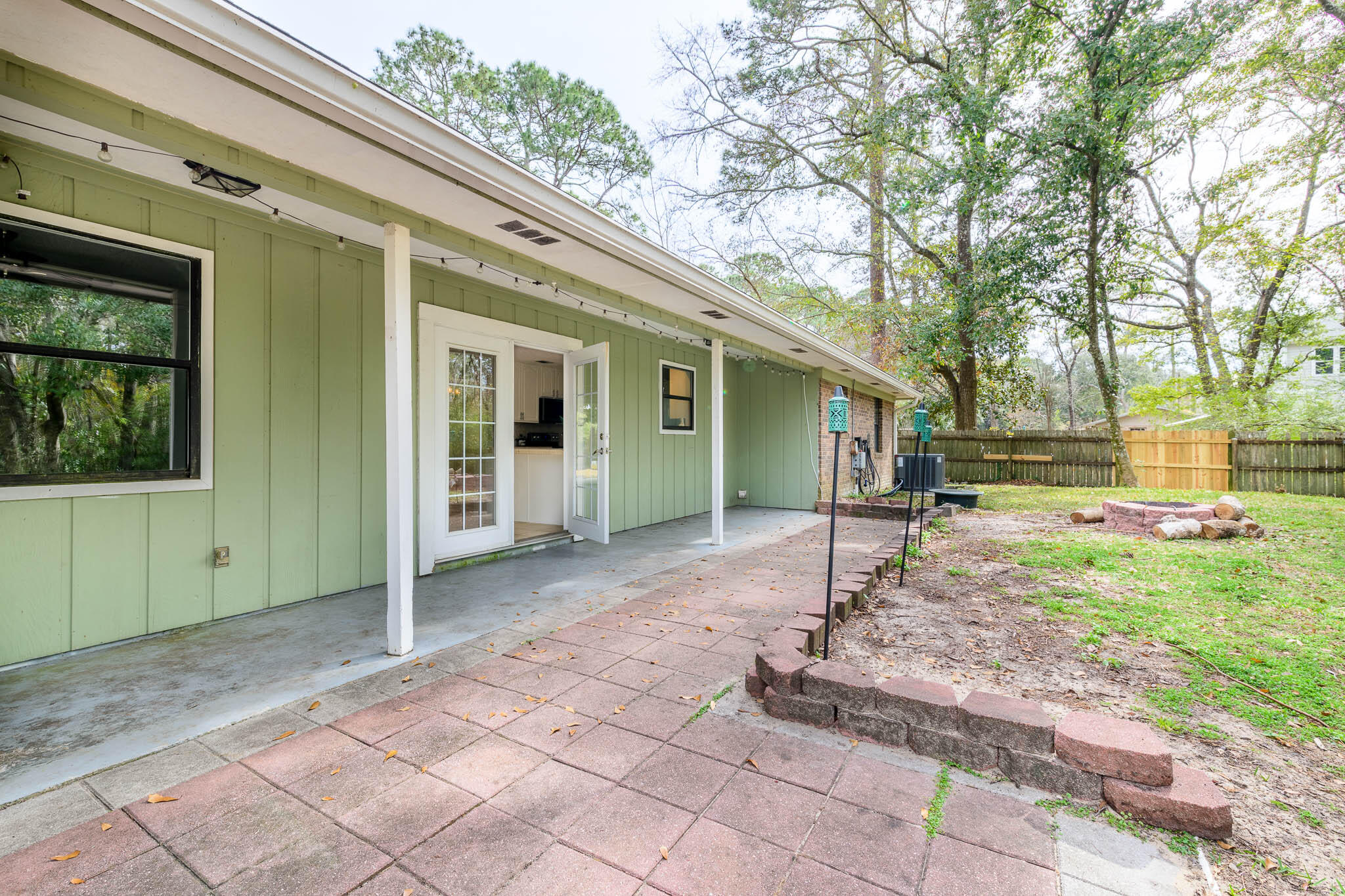 1688 Vine Avenue Niceville, FL 32578 - Photo 30 of 32 a view of a house with backyard and trees