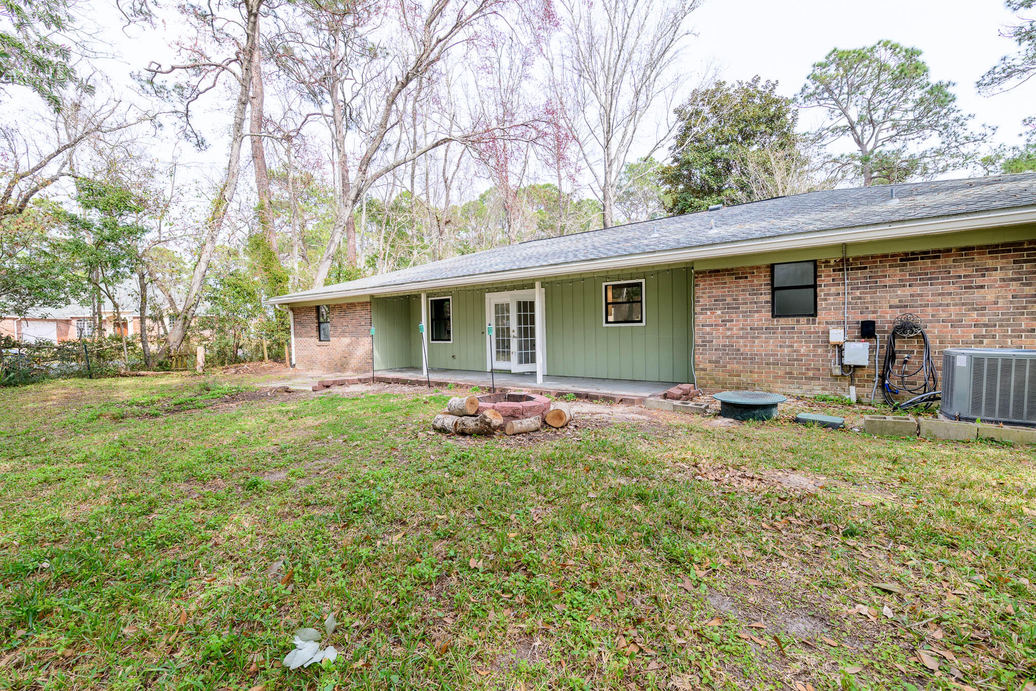 1688 Vine Avenue Niceville, FL 32578 - Photo 32 of 32 a view of a house with backyard and a tree