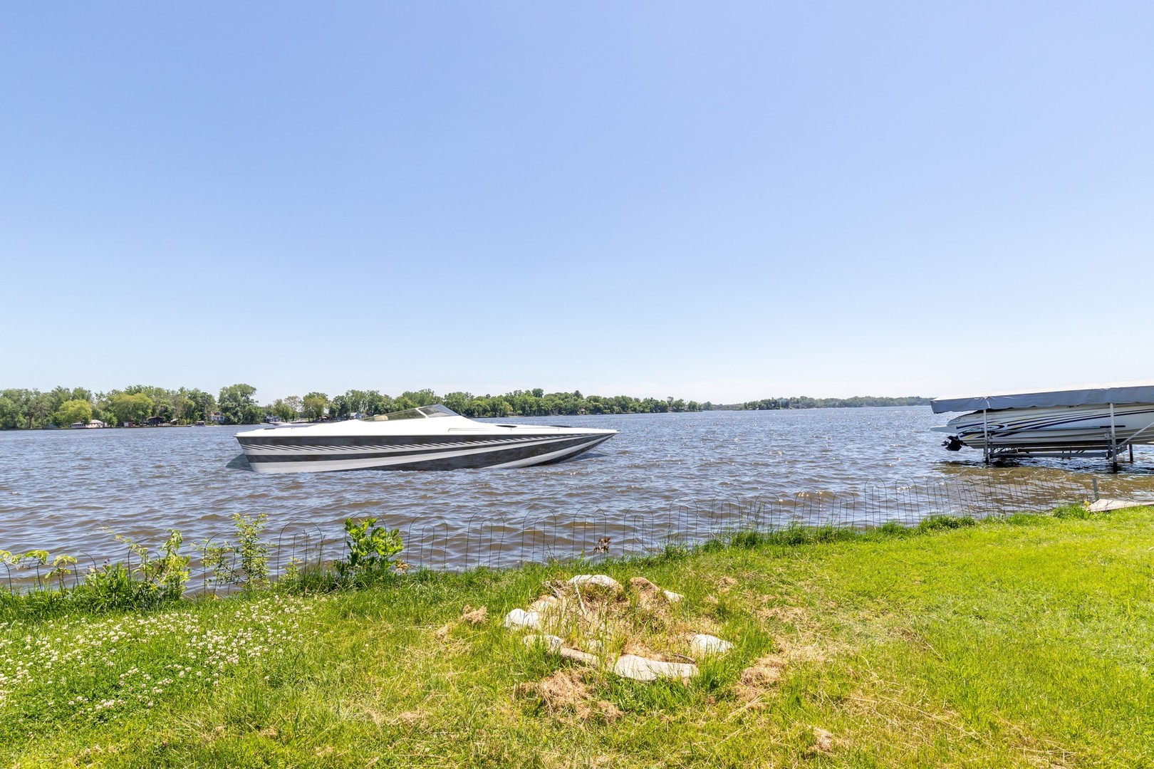 168 Eagle Point Road Fox Lake, IL 60020 - Photo 18 of 25 a view of an swimming pool and an outdoor seating