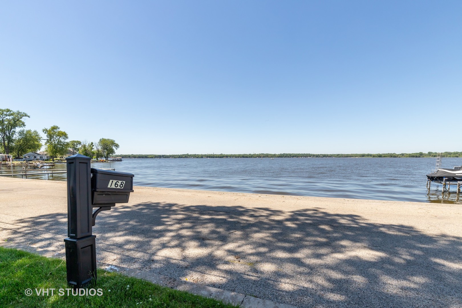 168 Eagle Point Road Fox Lake, IL 60020 - Photo 3 of 25 a view of a lake with a yard