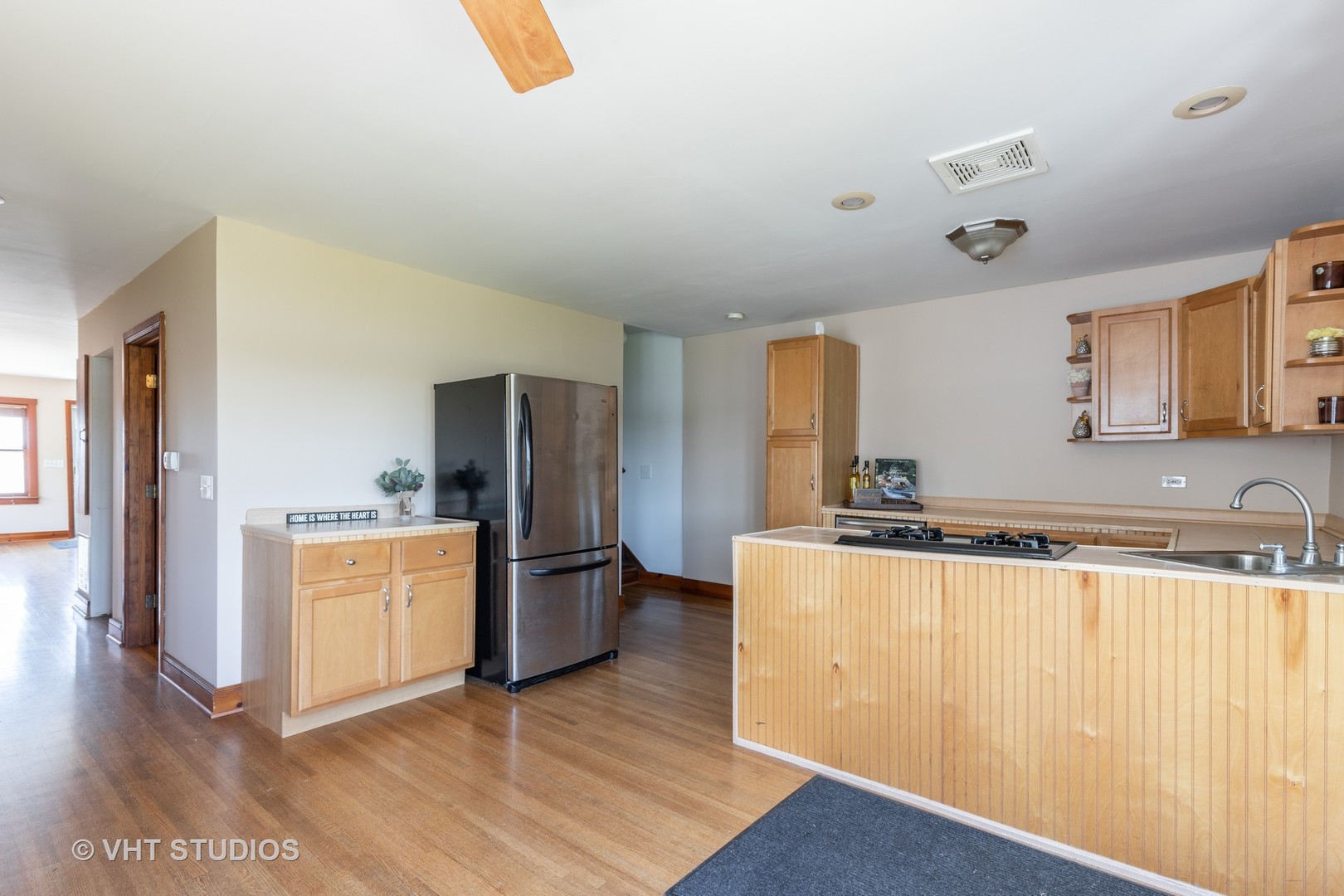 168 Eagle Point Road Fox Lake, IL 60020 - Photo 6 of 25 a kitchen with stainless steel appliances granite countertop a refrigerator a stove and a wooden floors