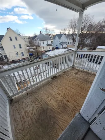 a view of balcony with wooden floor