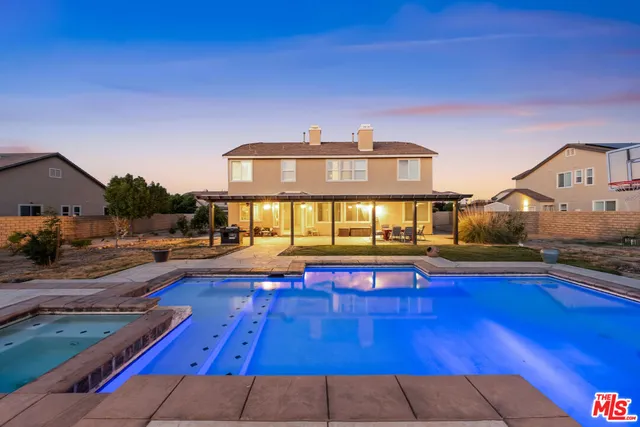 a view of a house with swimming pool