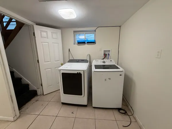 a view of an empty room with a fireplace