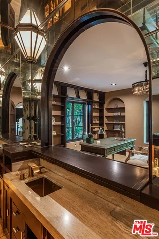 a view of kitchen with a sink and cabinet