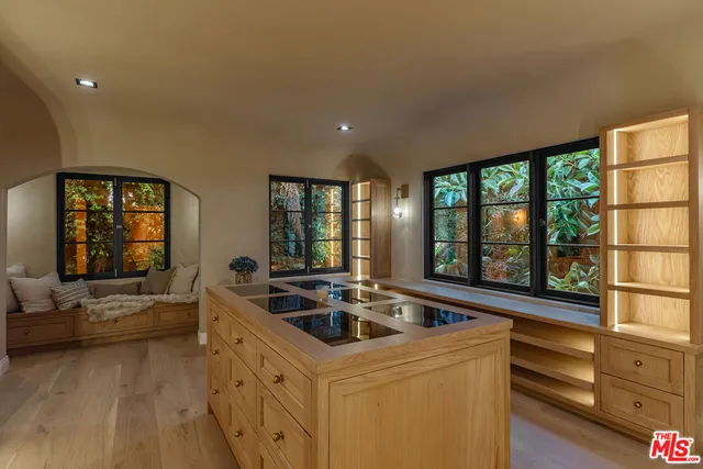 a bathroom with a sink a vanity and a large mirror