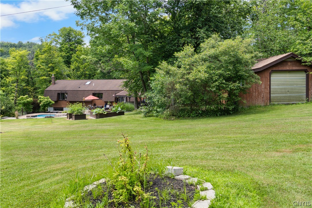 4456 Francis Road Fenner, NY 13035 - Photo 27 of 50 Backyard with dog kennel
